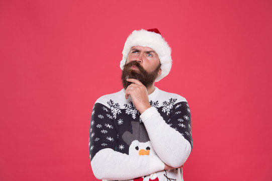 What if. Hipster bearded man wear winter sweater and hat. Happy new year. Winter plan. Man thoughtful face expression. Hard decision. Decision making. Make christmas wish. Life changing decision