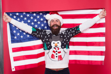 Merry american xmas. Happy Santa hold american flag. Bearded man celebrate xmas. Holiday decoration and decor. All american xmas party. Happy new year. Its xmas time