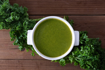cream or natural vegetable soup on rustic wooden background