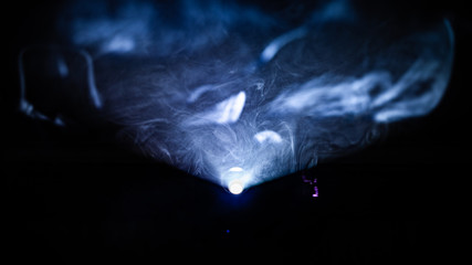 smoke infront of a light of projector