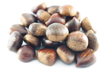 Chestnuts close up. Raw Chestnuts. Fresh sweet chestnuts. Food background.