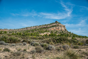 Fototapeta na wymiar Erosion on the rock and Mount Arabi, Yecla, Murcia, Spain