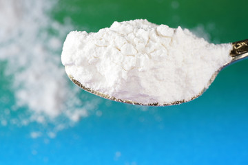 Flour with macro lens photographed against colorful gradient in studio