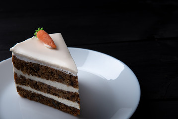 carrot keto diet cake on black background. healthy eating concept.