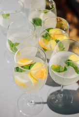 group made orange mint cocktails glasses table