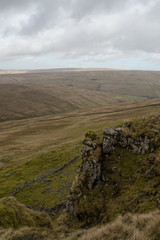 A view of a cliff edge from the side of Pen-y-ghent