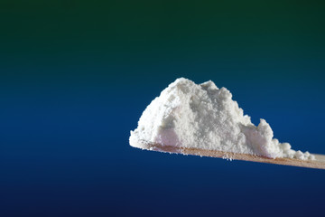 Flour with macro lens photographed against colorful gradient in studio