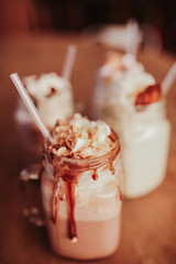 Close up shot of caramel milkshakes with marshmallows. Concept of restaurant, drinks and hospitality..