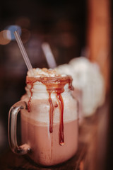 Close up shot of caramel milkshakes with marshmallows. Concept of restaurant, drinks and hospitality..