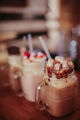Close up shot of milkshakes with toppings. Concept of restaurant, drinks and hospitality.