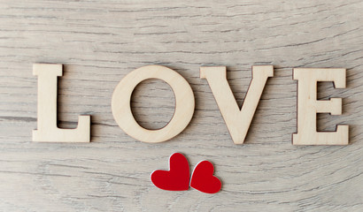 word Love from wooden letters on a wood background