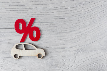 Car model and percent sign as a symbol of discount.