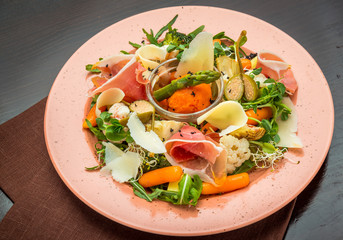 Fresh salad from vegetables, cheese and ham