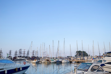 Boats on a marina. Yachts at blue sea.