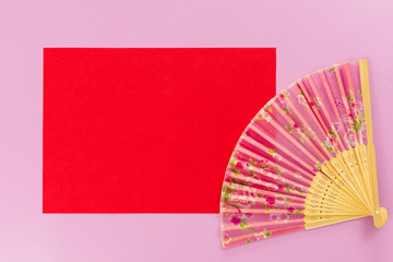 Pink hand fan with flowers