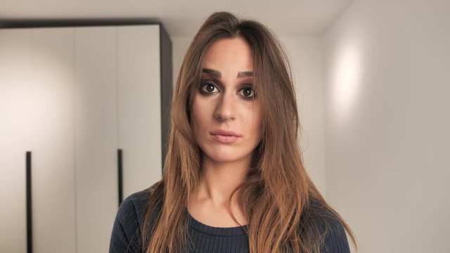 girl fluently flips through a thick book and is at a loss 4k