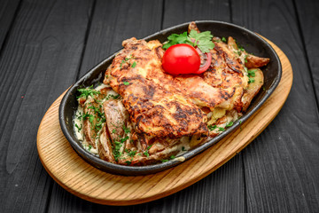 Fish dish - fried fish fillet with fried potatoes and vegetables