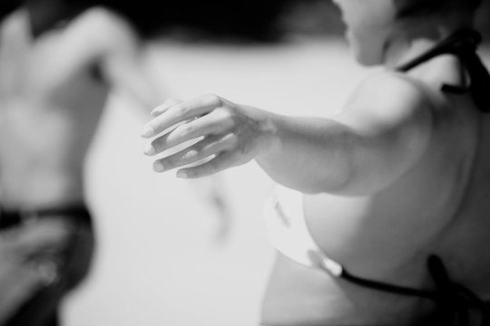 warmup on the beach, detail of a girl's hand during workout