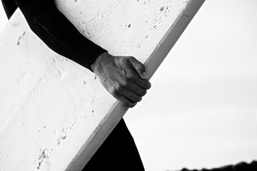 holding surfboard