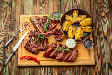 Grilled meat, porkchop with potatoes in pan