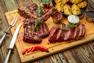 Grilled meat, porkchop with potatoes in pan