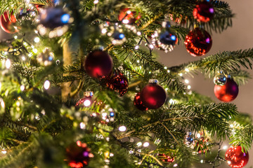 Christmas decorations in the Christmas tree. blurred background photo