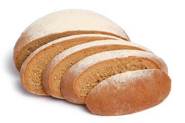 Loaf of fresh bread partially sliced on white background
