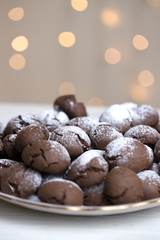 Chocolate brownie cookies in powdered sugar.
