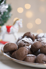 Chocolate brownie cookies in powdered sugar.