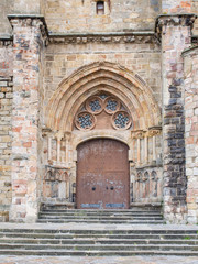 Stone arch in the door of a church in Castro Urdiales, Spain