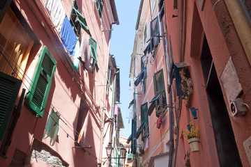 Fototapeta na wymiar Street in Monterosso, Italy with windows, clothes