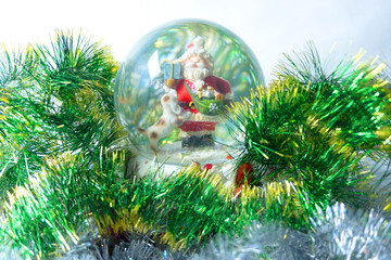 Christmas toy close-up on a background of bright green ribbon