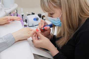 The process of cleaning the nail from the old coating and giving it the desired shape.
