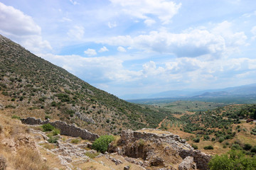 Fototapeta na wymiar Slope of the hill with stones of ancient greek city Mycenae ruins Peloponnese