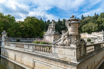 Fototapeta na wymiar A beautiful fountain in the Jardin de la fontaine in Nimes