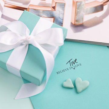 Minsk, Belarus. November, 2019: Luxury, trendy jewelry Tiffany box.  The world-famous American fashion brand. Silver and gold jewelry - best present for every holiday.