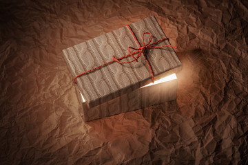 Gift box with ajar lid, bright light inside. Surprise. fulfillment of dreams, desires. Gifts...