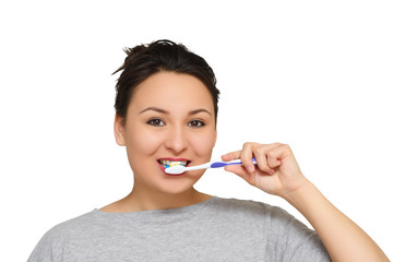 a pretty young girl brushing her teeth