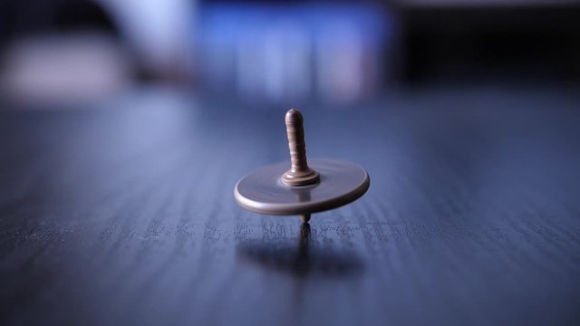 Whirligig spinning in circles on table