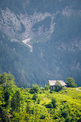 View from Podol&scaron;eva over tiny hut to mountain Raduha, Slovenia