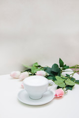 Delicious coffee cappuccino with pink flowers