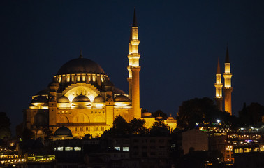 Fototapeta na wymiar Istanbul, Turkey, Middle East: night skyline of the city with view of the illuminated Suleymaniye mosque, Ottoman imperial mosque commissioned by Suleiman the Magnificent and designed by Mimar Sinan