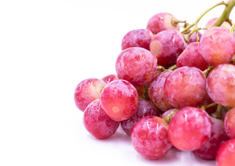 Red grape. White background. Close-up.