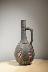 Ceramic bottles with ornament of fruits and leaves of grapes.
