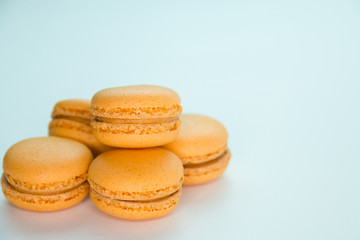 Macaroons on white background top, colorful yellow macaroons, selective focus