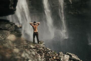 guy and waterfall cachoeira herculano