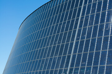 Solar panels installed on the oval wall of the stadium.