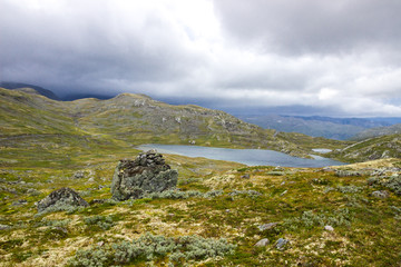 Fototapeta premium blac clouds over Sognefjellet mountain road in Norway