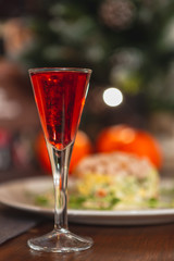Set of glasses with different colored tinctures made on the basis of fruits and alcohol, a wonderful aperitif before the festive dinner