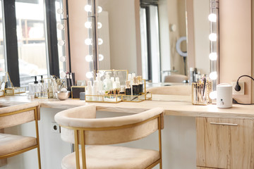 Dressing room interior with makeup mirror and table. Place for applying makeup